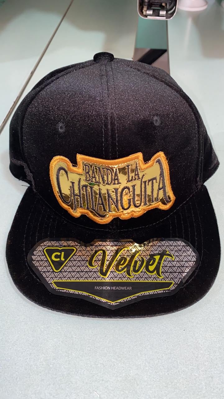Black baseball cap with Banda La Chittanquita orange embroidered logo and gold Veber text on brim