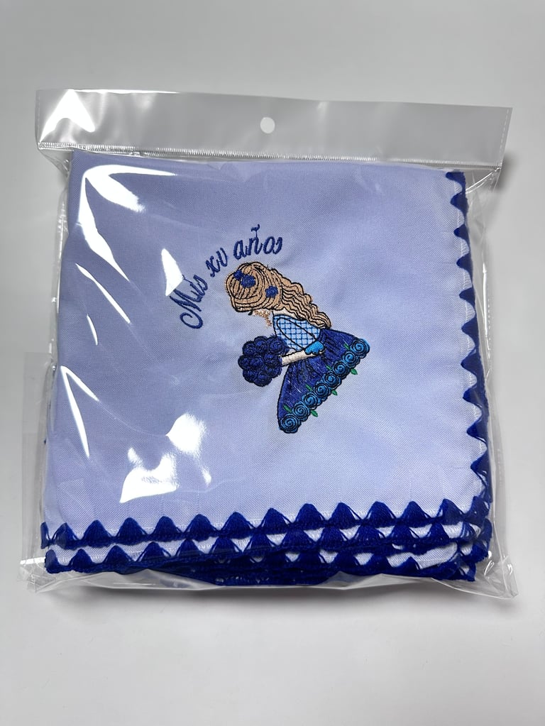 Packaged light blue baby blanket with embroidered sleeping baby design and dark blue scalloped trim edges