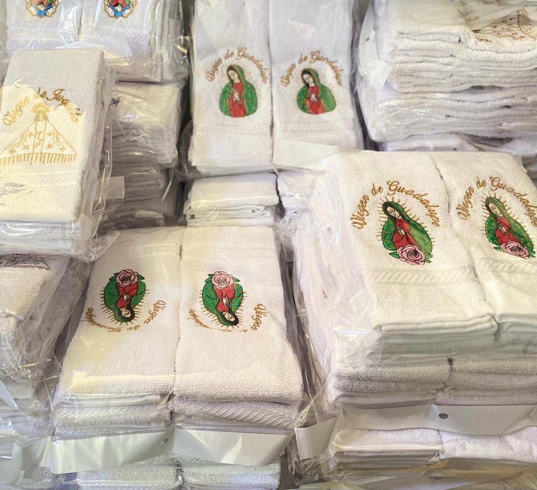 Packaged religious napkins and linens with Virgin Mary and Christmas designs displayed in clear plastic wrapping